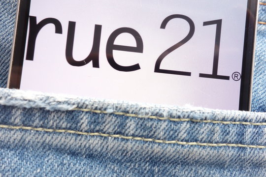 KONSKIE, POLAND - JUNE 02, 2018: rue 21 logo displayed on smartphone hidden in jeans pocket
