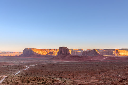 Beautiful panoramic sunset view over famous Buttes of Monument Valley on the border between Arizona and Utah, USA © Artem
