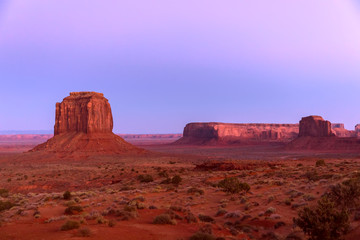 Fototapeta na wymiar Beautiful panoramic sunset view over famous Buttes of Monument Valley on the border between Arizona and Utah, USA