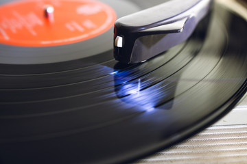 Close up of vinyl record player on a white background. Shallow depth of field, focus select.