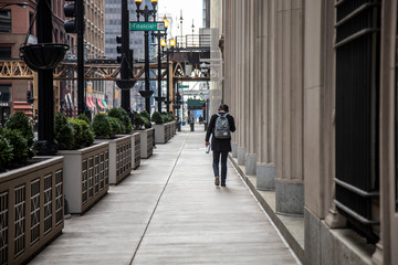 Chicago,IL/USA-March 24th 2020: Streets of downtown Chicago around State street and Michigan ave are completely isolated, desolated, empty  due the national health pandemic Covid-19 