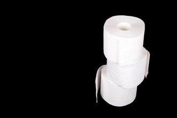 Three white toilet paper rolls isolated on black background. Banner with toilet paper rolls and...