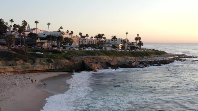 Aerial drone footage of La Jolla during a beautiful sunset with clear skies. San Diego, California, USA. 