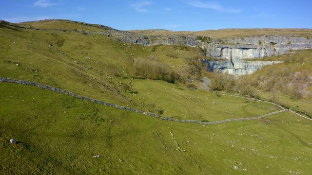 4k drone footage of Malham Cove a limestone landmark in the Yorkshire Dales National Park, UK