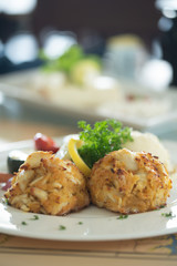 Crabcake dinner on plate in restaurant