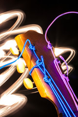 Acoustic guitar with electroluminescent wire for strings
