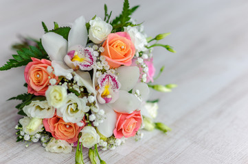 bouquet of fresh flowers from roses, orchids and white eustoma