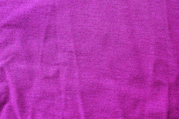 Wrinkled violet fabric texture, empty cloth background. Cotton fiber structure, natural clothing fabric pattern, blank crumpled textile