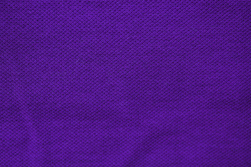 Violet fabric texture, empty seamless dark blue background image. Unprinted surface design, blank violet cloth detail close up top view with copy space