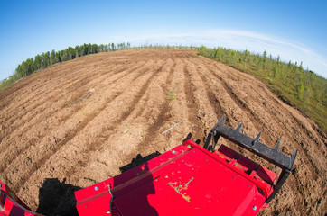 Reclamation of an oil production site. Lamtrac mulcher LTR8400 at work. Mulching the swamp.