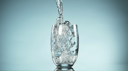 Freeze motion of pouring water into glass
