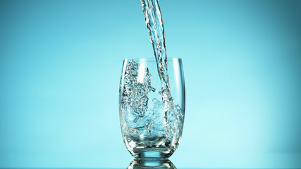 Freeze motion of pouring water into glass