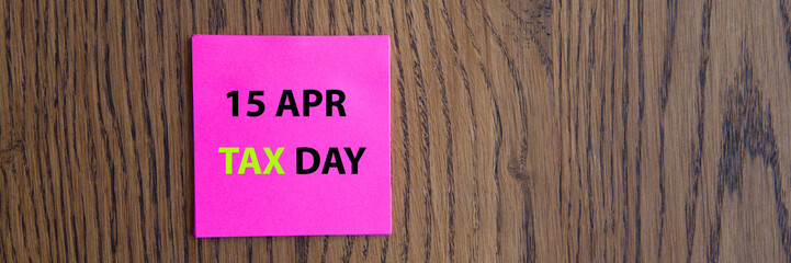 April 15 tax daywritten on colorful sticky notes