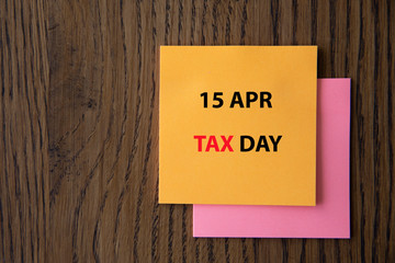 April 15 tax daywritten on colorful sticky notes