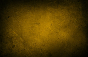 Dark yellow grunge textured concrete wall background