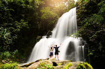 Tourists are excited about Rak Jang Waterfall during a trip in Chiang Mai, Thailand. Landmark in Chiang mai - obrazy, fototapety, plakaty