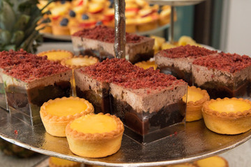Fruit tartlets dessert and pastry cake sweets on trays