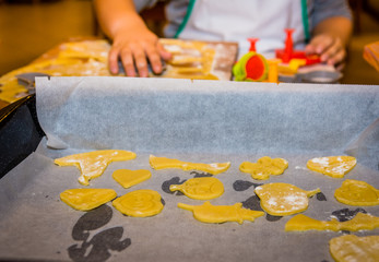 Children making cookies for holidays.