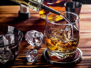 Pouring whisky on the rocks