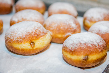 Obraz na płótnie Canvas Home made donuts freshly baked and ready to be served.