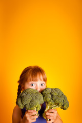 Shocked Little Girl Holding Broccoli, Healthy Eating, Food, Nutrition