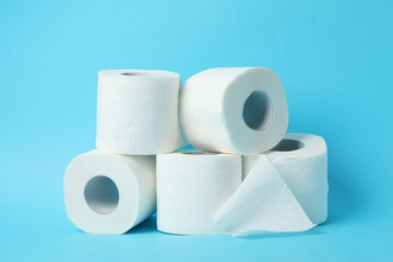 Rolls of toilet paper on blue background