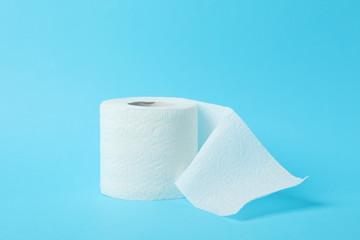 Toilet paper on blue background, space for text