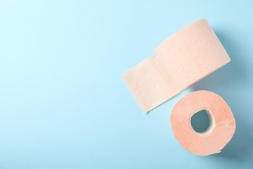 Toilet paper on blue background, space for text