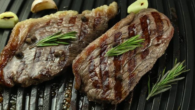  beef steaks grilled with garlic and rosemary