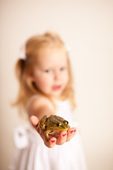 Little Princess Girl Holding a Frog