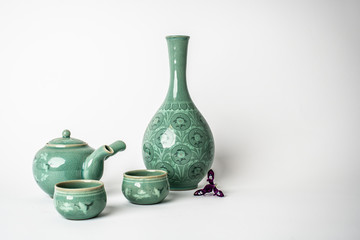 Celadon tea set on white background