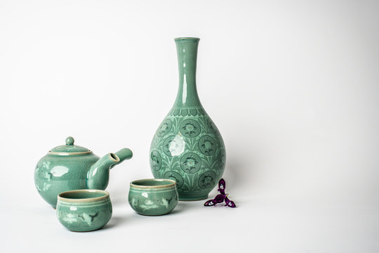 Celadon tea set on white background