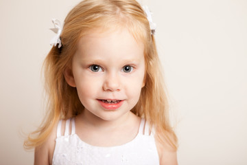 Portrait of Happy Little Blond Girl Smiling