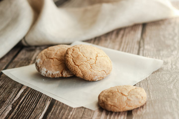 Almond cookies on the wood table. Romantic composition