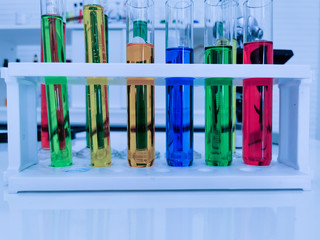 the glassware of color chemical testing COVID-19 VIrus in medical science laboratory