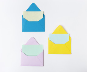 Set of Three of colorful blank envelopes for invitation, on light background with blank card....