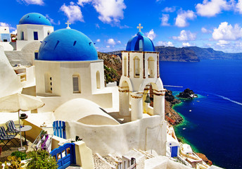 Iconic Santorini - most beautiful island in Europe. view with traditional churches in Oia village....