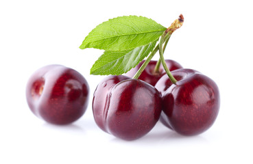 Cherries with leaves isolated on white background