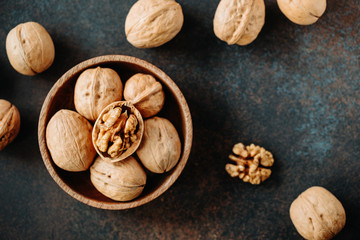 Top view on a heap of walnuts on a table.
