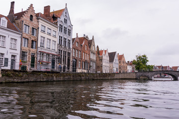 Naklejka premium Beautiful medieval city of Bruges in Belgium (Europe). Full of bridges and water channels, surrounded by fantastic buildings.