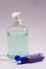 The antibacterial was turquoise in a transparent bottle with a dispenser and a purple hand antiseptic