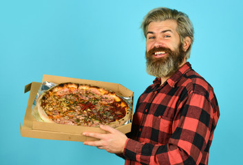 giving food order and holding pizza. hungry man eating pizza. fast food Delivery. eating delicious cheesy pizza. happy bearded man italian food. italy is here. Cooking food concept