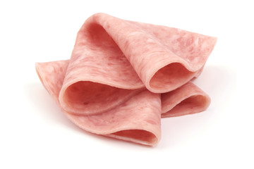 Thin salami sausage slices, isolated on white background