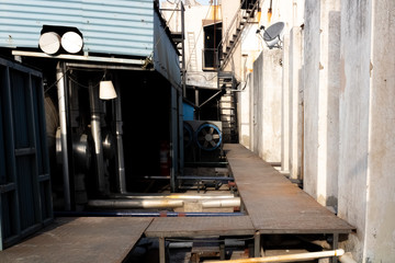 Unique architecture photography of machinery and mechanical instruments on a building terrace.