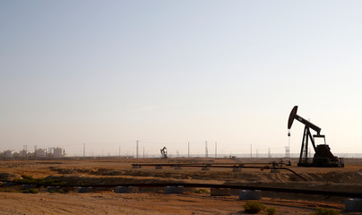 Oil pump jack in Omani desert