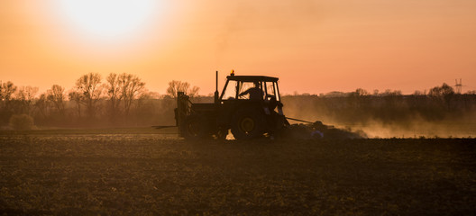 Fototapeta premium tractor plowing the field