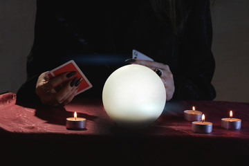 Mental readings and clairvoyance concept. Fortune telling on crystal balls and cards