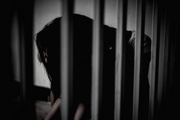 Obraz premium Hands of women desperate to catch the iron prison,prisoner concept,thailand people,Hope to be free,If the violate the law would be arrested and jailed.