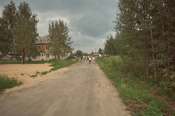 people walk on a country road