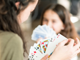 girl playing with cards